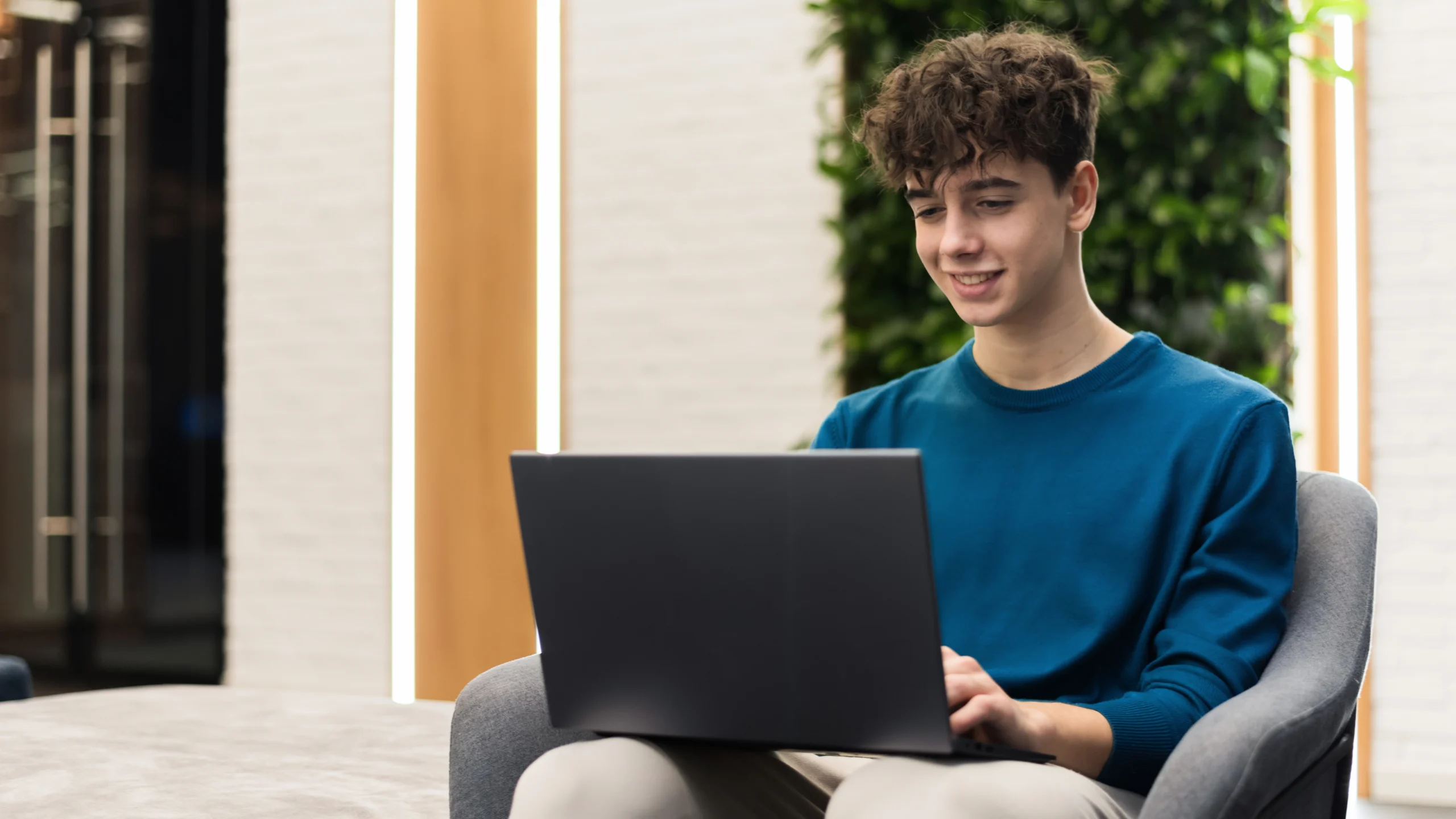 Student with laptop having online counselling session from home
